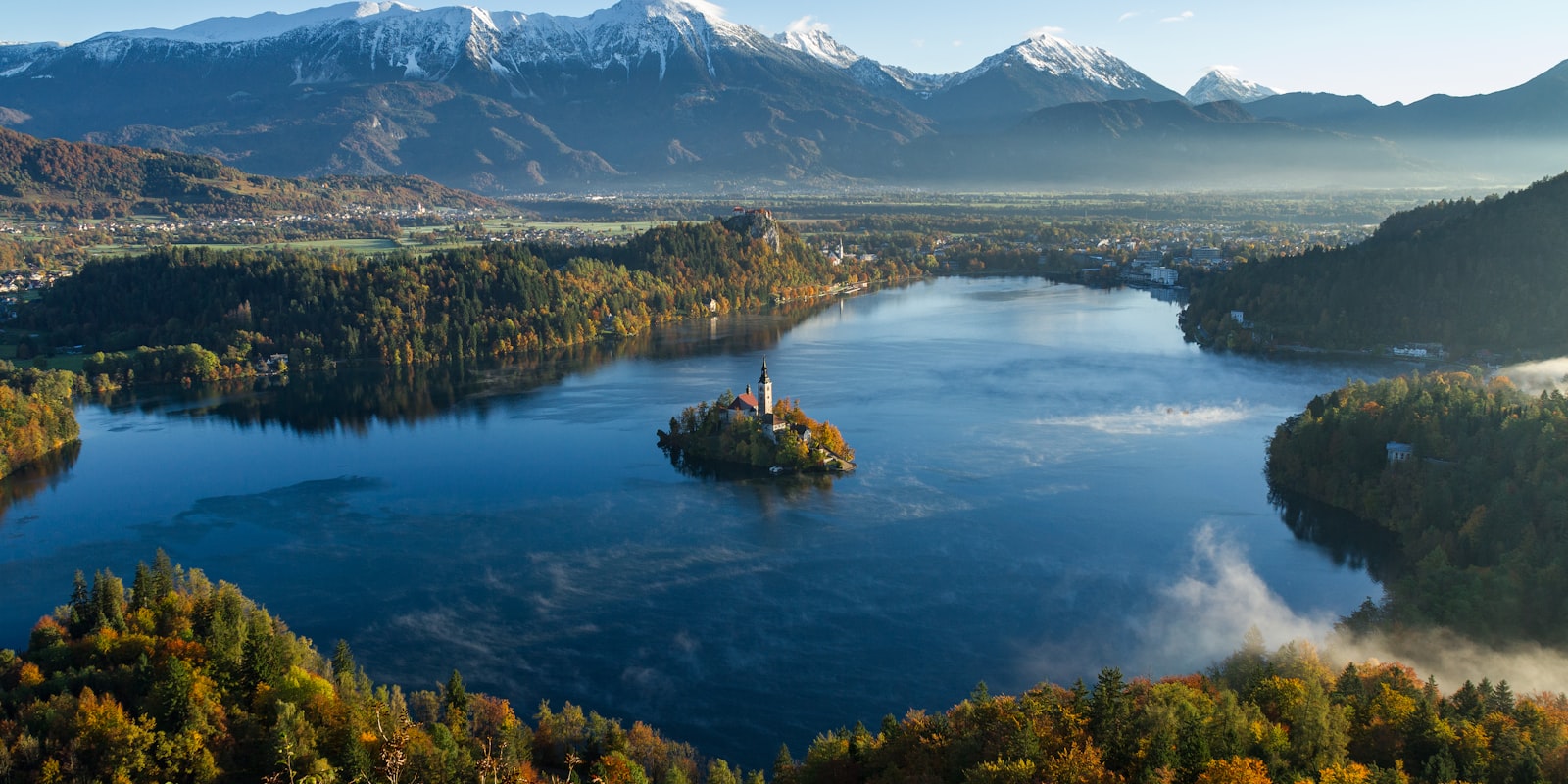 Lake Bled in Slovenia with its island church and snow-capped Alps in the background